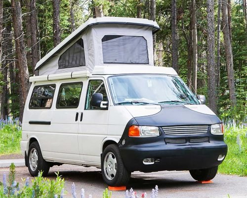 55281-camper-van-on-rural-road-pioneer-mountains-2021-08-28-23-40-24-utc